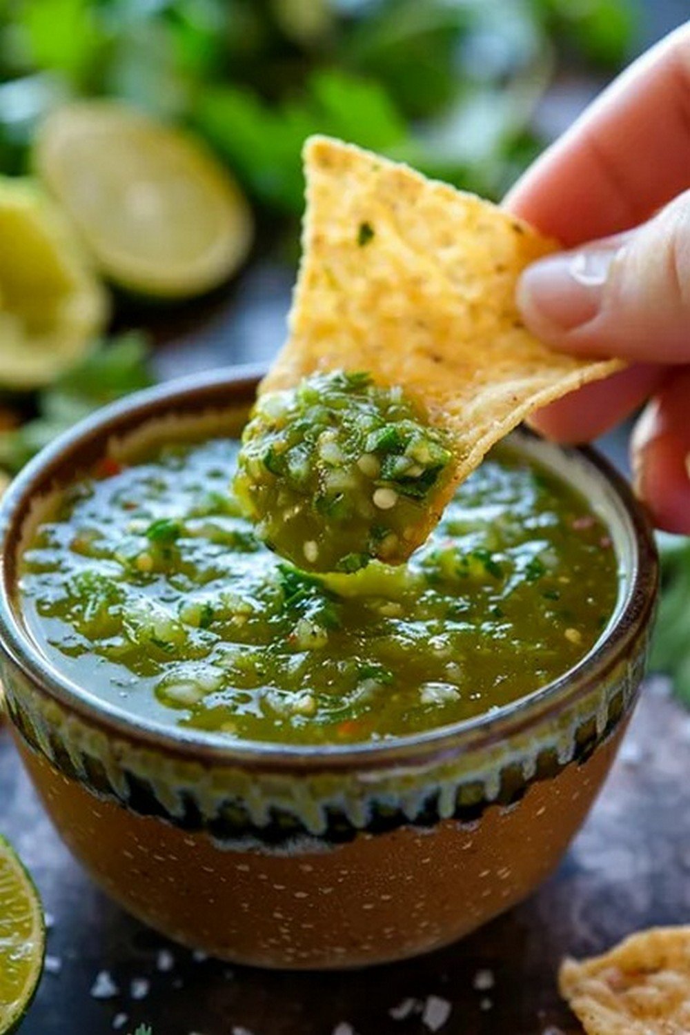 Action dip shot of Chipotle Tomatillo Green Salsa
