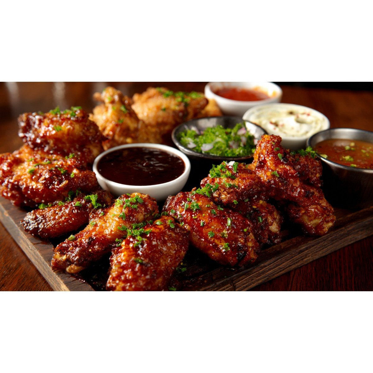 game day wing platter with multiple sauces and crispy wings