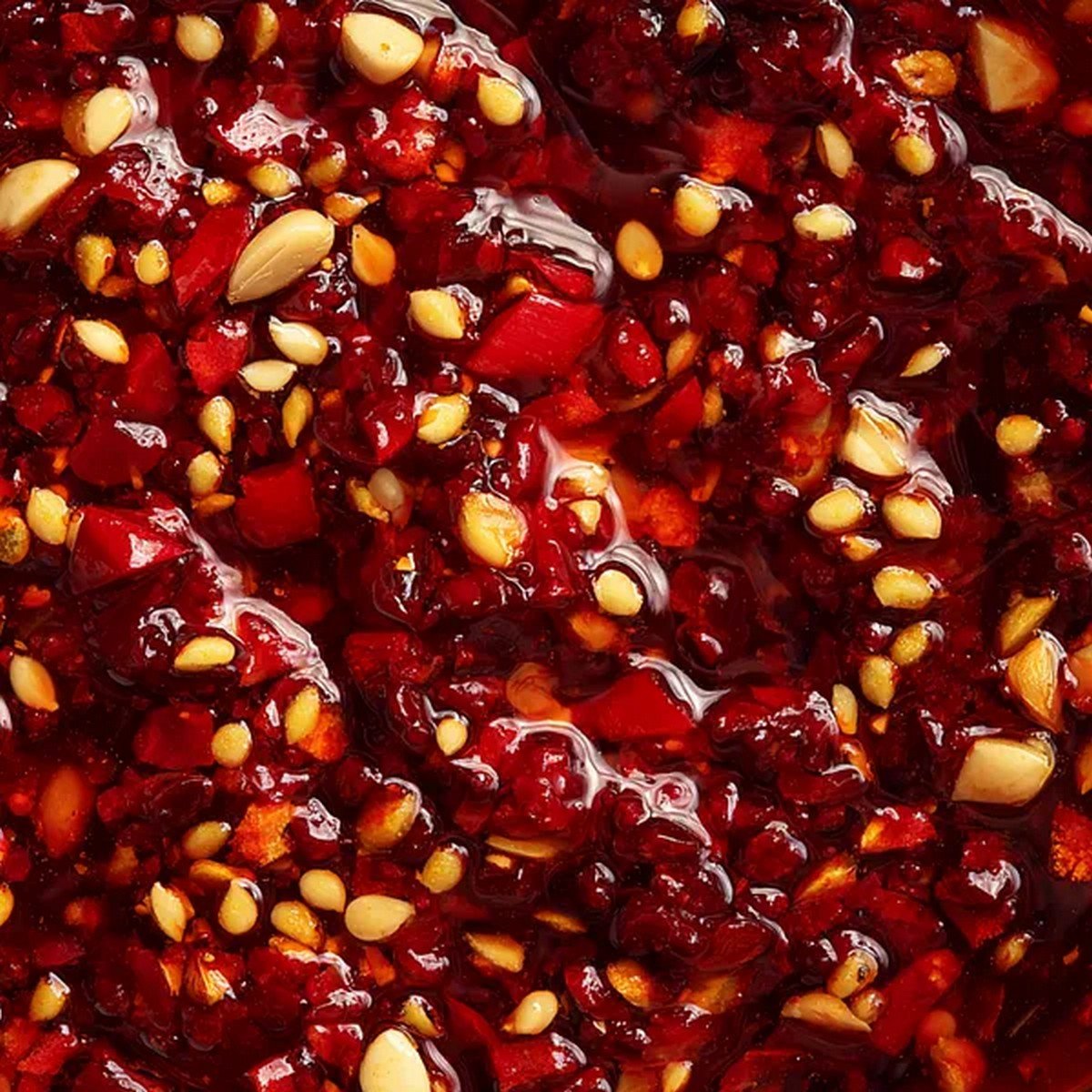 thick garlic chili sauce close up with chili and garlic pieces