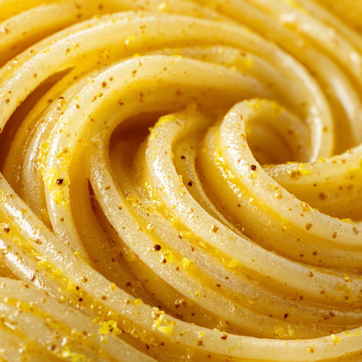 glossy lemon butter sauce texture close up with citrus zest