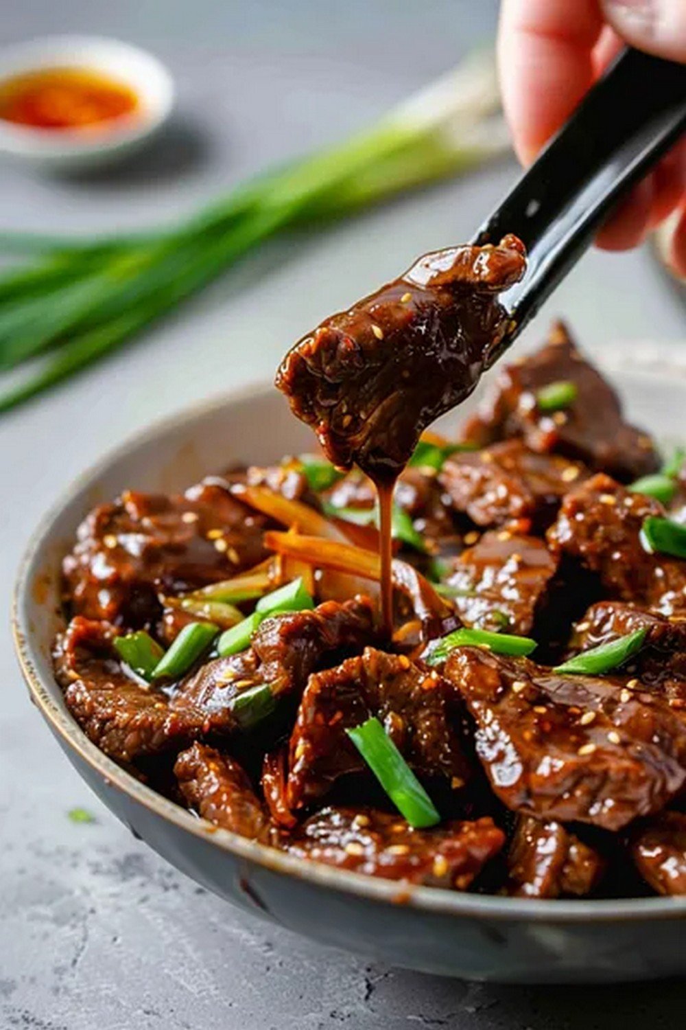 Action dip shot of Mongolian Beef Sauce
