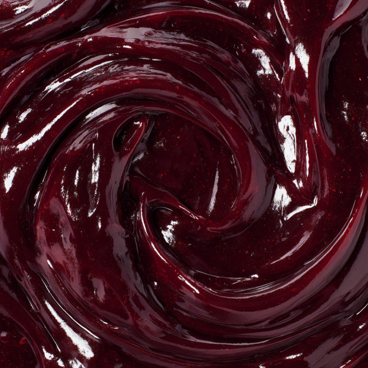 thick red wine reduction sauce glossy texture close up
