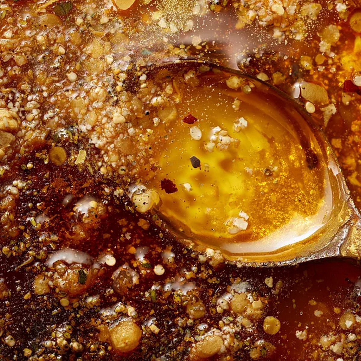 rich seafood boil sauce served with shrimp crab and corn